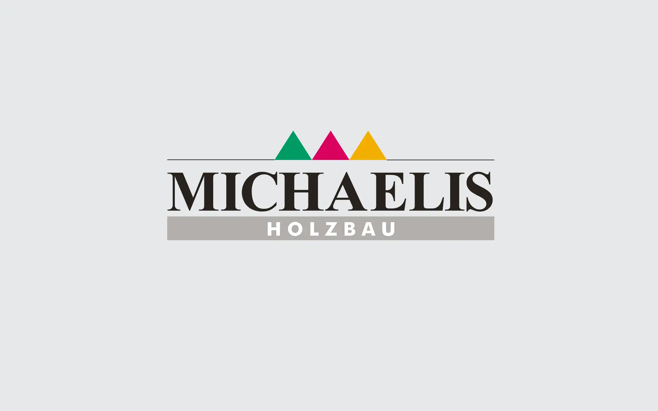 Frühere Logo-Version von Michaelis Holzbau als Ausgangspunkt vor der gestalterischen Überarbeitung des Markenauftritts.