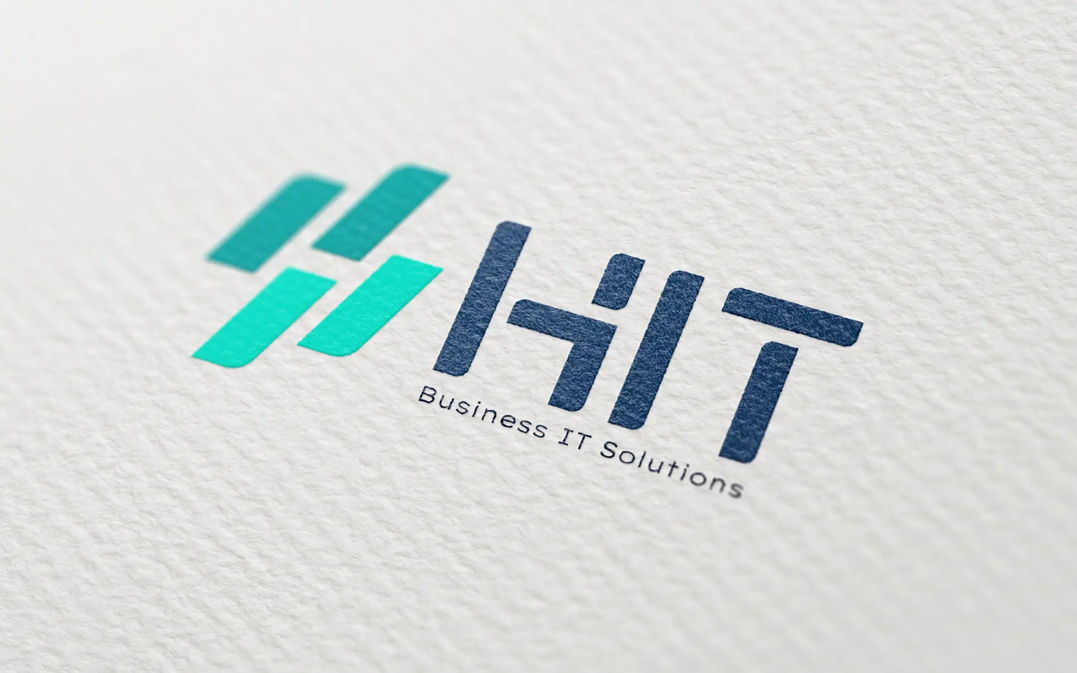 Logo-Mockup der HIT Computer GmbH & Co. KG auf hochwertigem Papier mit modernisiertem Erscheinungsbild und neuem Corporate Design für das IT-Systemhaus aus Harsefeld.